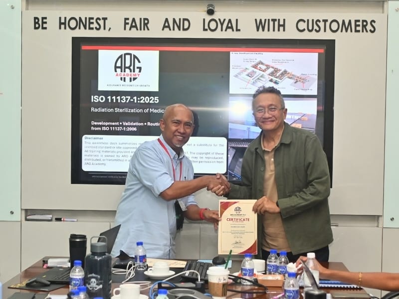 Certificate presentation to a participant at the ISO 11137-1:2025 training by ARG Academy